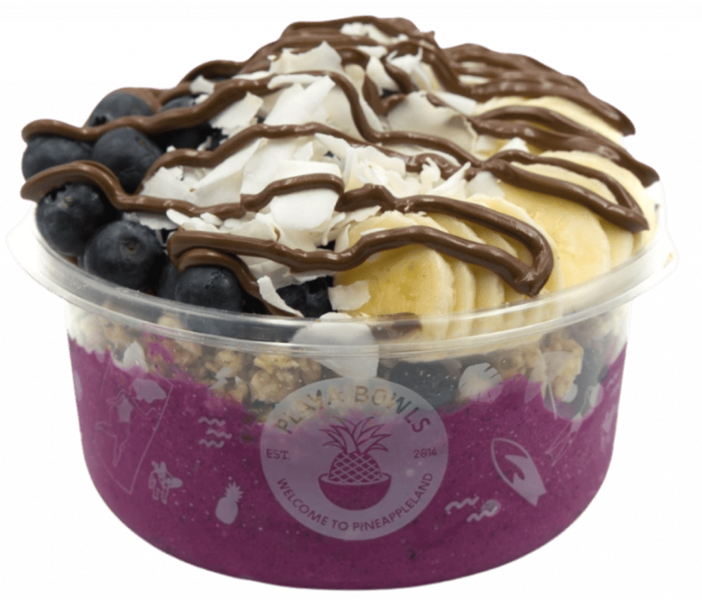 Pitaya blend topped with granola, banana, blueberry, coconut flakes, raw cacao, nutella drizzle